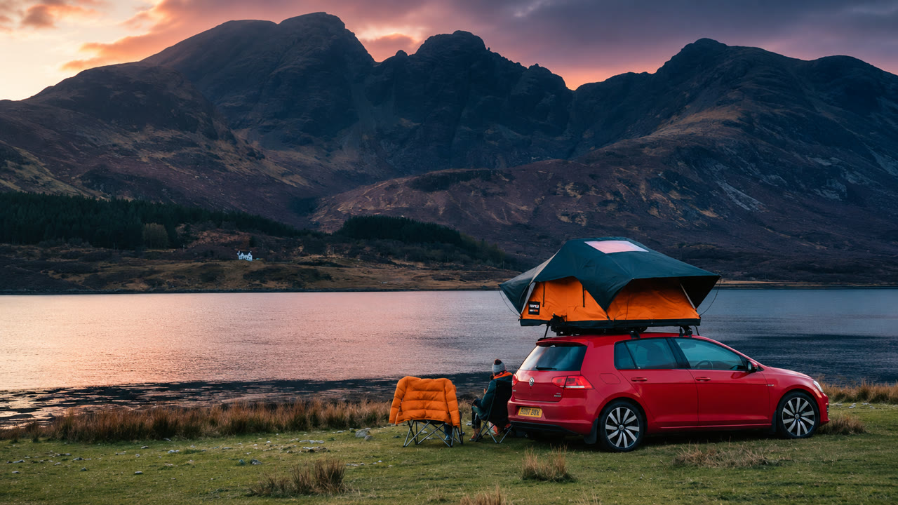 TentBox roof tent setup on a Land Rover at camp